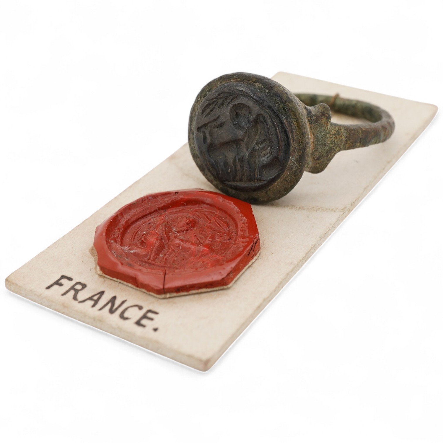 A bronze signet ring, France, possibly Roman or later, depicting a man, possibly Pan or a satyr, with a goat, mounted in bronze, size P1/2, Provenance: formerly in the collection of Dame Joan Evans (1893-1977)